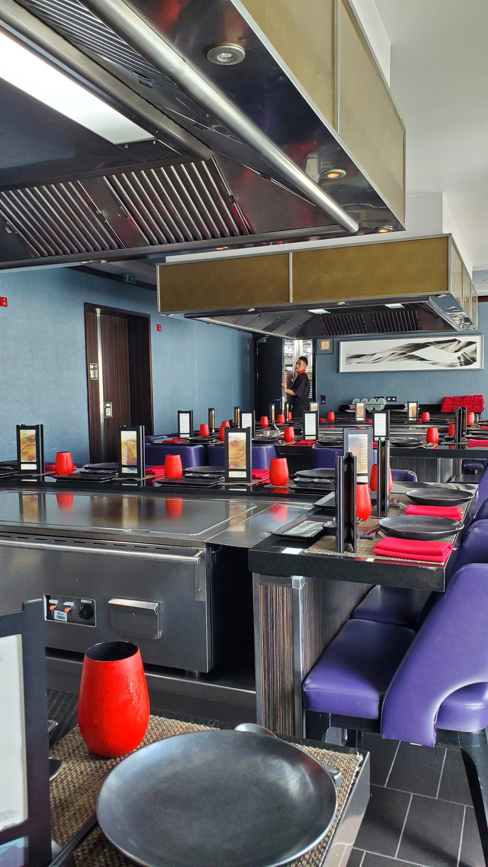 Stainless-steel cooking stations in a cruise ship restaurant